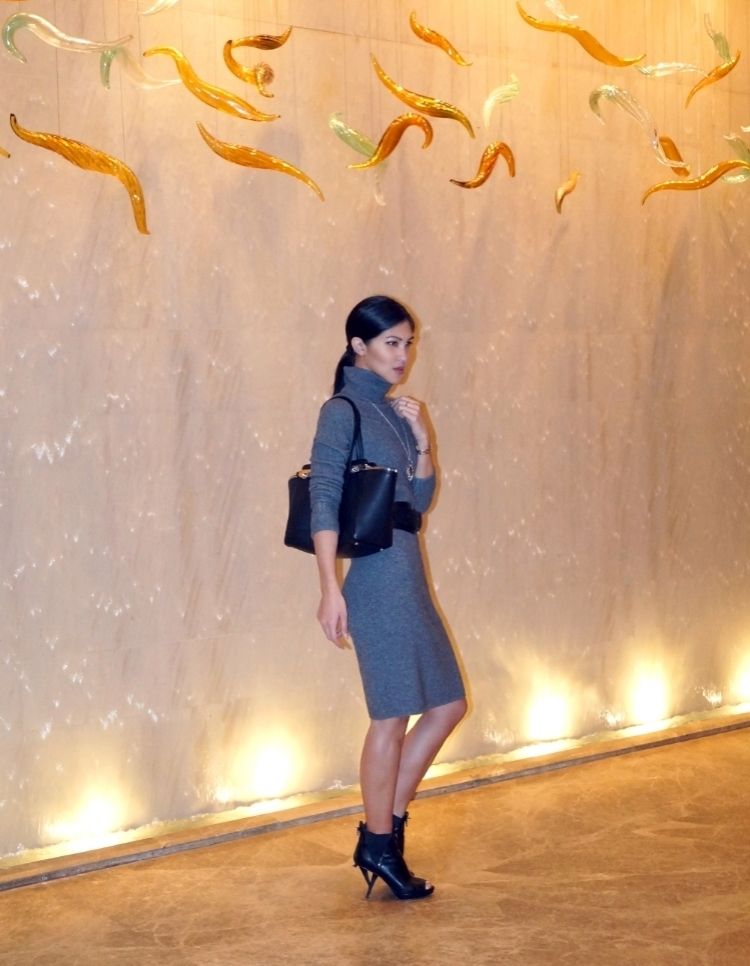 Euriental | fashion & luxury travel | wearing cashmere jumper dress with waist-cinching belt, Salvatore Ferragamo bag and ankle boots at Shangri-La, Shanghai.